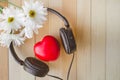 Relaxation and cozy with Heart listen music and Daisy on wooden Royalty Free Stock Photo