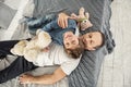 Delighted son and daddy relaxing on bed Royalty Free Stock Photo