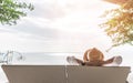 Relaxation holiday vacation of businessman take it easy happily resting on beach chair at swimming pool poolside beachfront resort