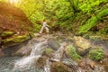 Relaxation joga in forest at the Waterfall. Virabhadrasana pose Royalty Free Stock Photo