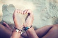 Relaxation and Leisure in Summer lifestyle image of slim tanned girl on beach, Royalty Free Stock Photo