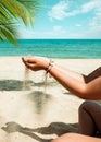 Relaxation and Leisure in Summer lifestyle image of slim tanned girl on beach Royalty Free Stock Photo