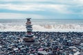 relaxation at sea. Stack of stones on beach, nature background. Stone cairn on sea blurry background, pebbles and stones Royalty Free Stock Photo