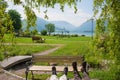 Relaxation at spa garden Schliersee, on a bench, green willow branches