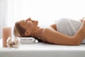 Beautiful Middle Aged Woman Lying On Massage Table In Luxury Spa Salon Royalty Free Stock Photo