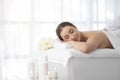 Relaxation And Wellness. Young Woman Lying On Massage Table In Spa Salon Royalty Free Stock Photo