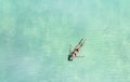 Relaxation with young woman in the water of ocean in red bikini -Summer concept Royalty Free Stock Photo