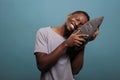 Relaxed adult putting head on comfortable pillow to sleep