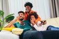 African american family watching tv together Royalty Free Stock Photo