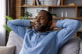 Relaxed african american man enjoying a quiet moment at home Royalty Free Stock Photo