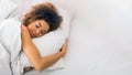 Relaxed woman sleeping on bed at home Royalty Free Stock Photo