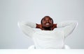 Relaxed african man sitting at the table