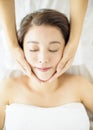 Relaxed beautiful Young woman enjoy massage in spa salon Royalty Free Stock Photo