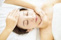 Relaxed beautiful Young woman enjoy massage in spa salon Royalty Free Stock Photo