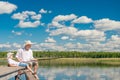 Relaxed boy with his father on a fishing trip Royalty Free Stock Photo