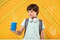 Relaxed boy looking at the glass of hot chocolate while visiting a cafe Royalty Free Stock Photo