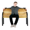 Relaxed boy sitting on bench Royalty Free Stock Photo