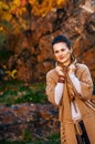 Relaxed brunette woman walking in beautiful evening autumn park Royalty Free Stock Photo