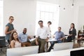 Relaxed business colleagues in their office smile to camera Royalty Free Stock Photo