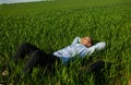 Relaxed Businessman Lying On Grass At Park Royalty Free Stock Photo