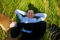 Relaxed Businessman Lying On Grass At Park Royalty Free Stock Photo