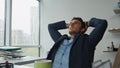 Relaxed businessman leaning chair in office. Focused man thinking problems Royalty Free Stock Photo