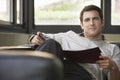 Relaxed Businessman Sitting On Sofa With Folder Royalty Free Stock Photo
