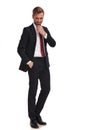 Relaxed businessman thinking and looking down while standing Royalty Free Stock Photo