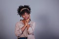 Relaxed and calm. Attractive afro american woman in casual clothes in the studio