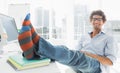 Relaxed casual man with legs on desk in office Royalty Free Stock Photo