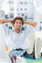 Relaxed casual man with legs on desk in office Royalty Free Stock Photo