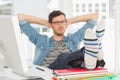 Relaxed casual young man with legs on desk Royalty Free Stock Photo
