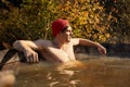 Relaxed male relaxing in hot tub jacuzzi outdoor