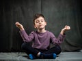 Relaxed child practicing yoga