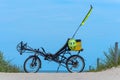 A recumbent bicycle on the beach