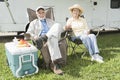 Relaxed Couple Sitting In Folding Chairs