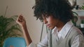 Relaxed girl reading book sitting at home table close up. Woman with literature