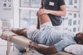 Relaxed dark-skinned man visiting his rehabilitation massage