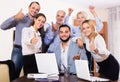 Relaxed employees sitting at desk