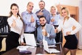 Relaxed employees sitting at desk