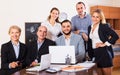 Relaxed employees sitting at desk