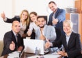 Relaxed employees sitting at desk