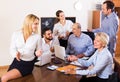 Relaxed employees sitting at desk