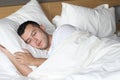 Relaxed ethnic male sleeping like a baby Royalty Free Stock Photo