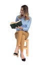Relaxed fascinated businesswoman reads while sitting