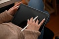 Relaxed female blogger create her online content via digital tablet. cropped