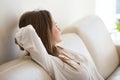 Relaxed female lying on sofa thinking or dreaming Royalty Free Stock Photo