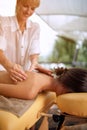 Relaxed female receiving a massage in a spa close up Royalty Free Stock Photo