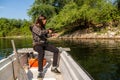 Relaxed fishing from boat in shallow water