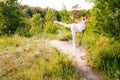 Relaxed girl practicing yoga, standing in Warrior three exercise, Virabhadrasana III pose Royalty Free Stock Photo